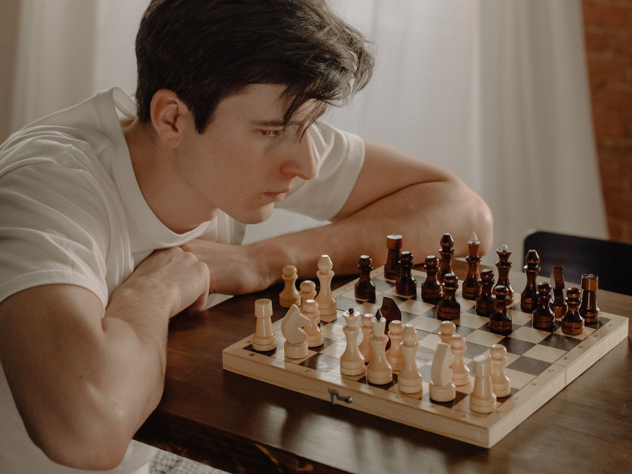 man planning chess